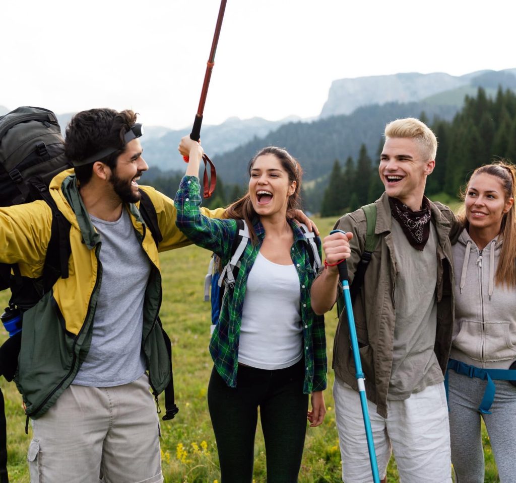 group-of-friends-trekking-with-backpacks-walking-in-the-forest.jpg